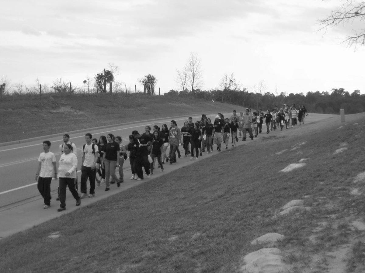 Trail of Dreams walkers crossing Fruitland Park, Florida.