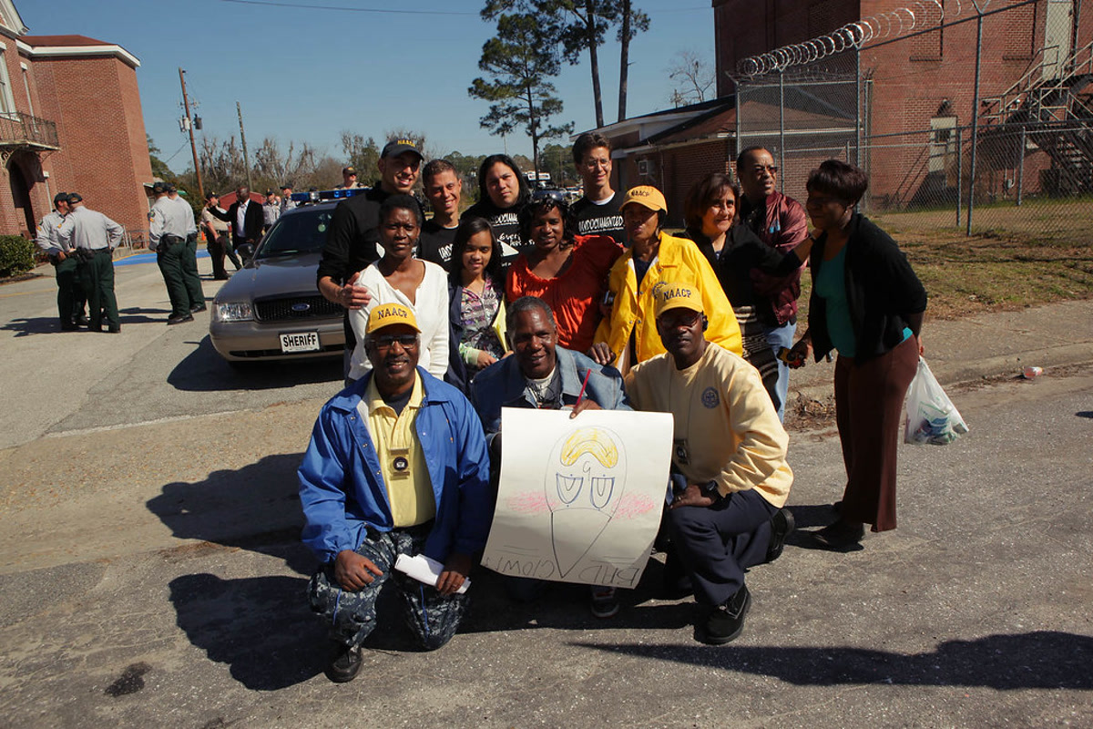 Trail of Dreams organizers and NAACP leaders protesting a Ku Klux Klan rally in Nahunta, Georgia.