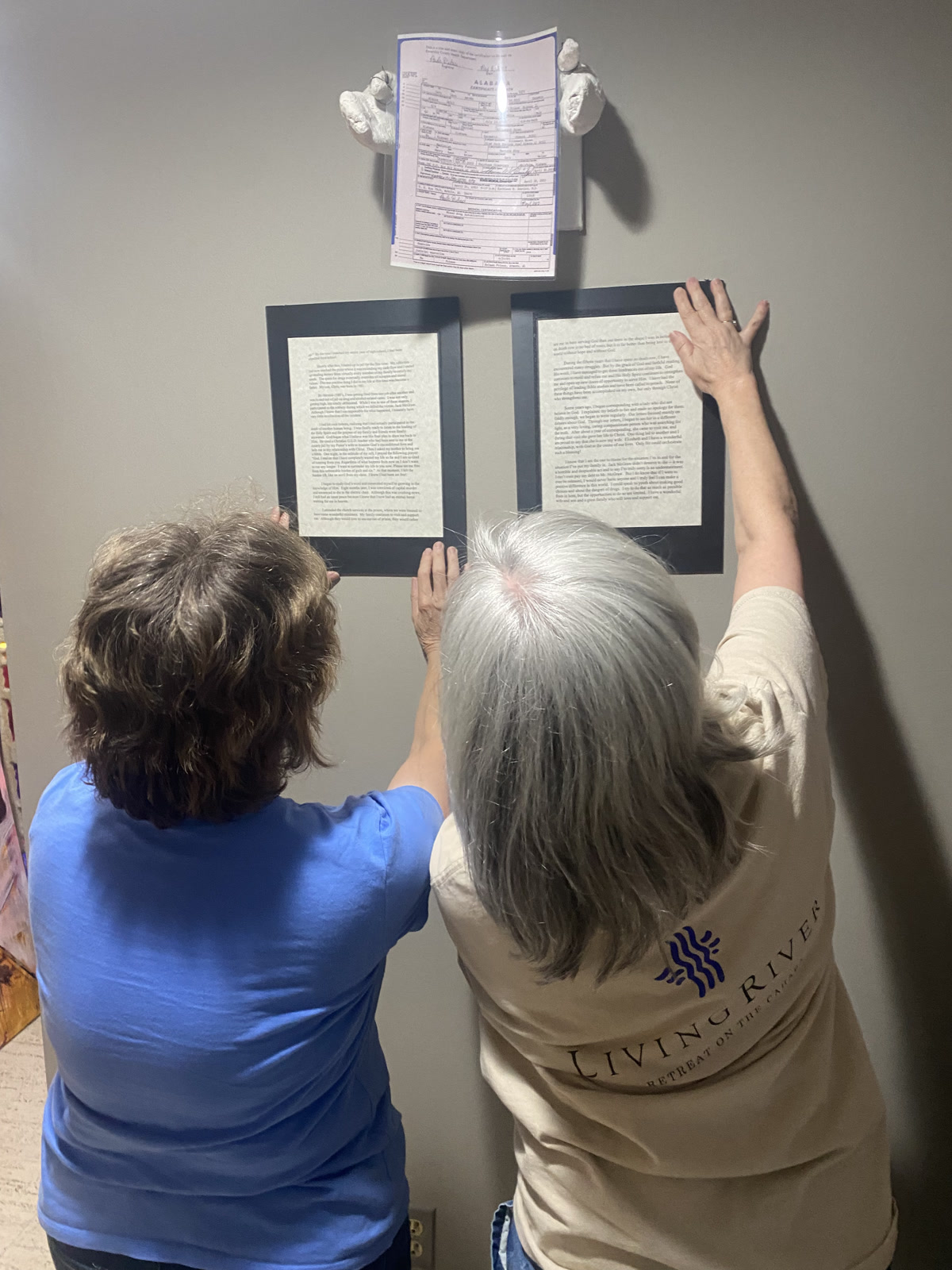 Volunteers from Grace Presbyterian Church help install the exhibit in Tuscaloosa, Alabama.