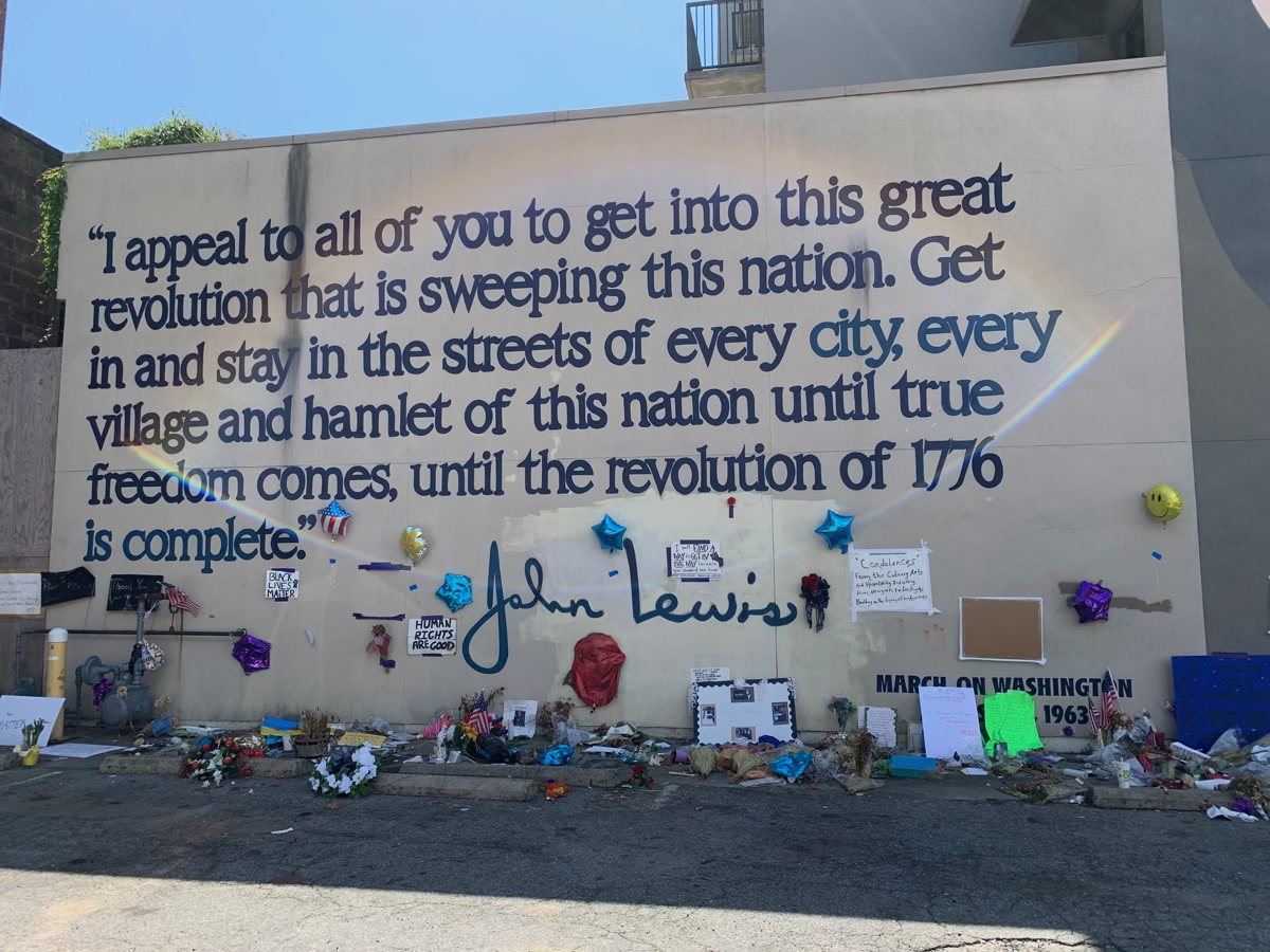 The citizen created memorial at the John Lewis mural in Atlanta following his death
